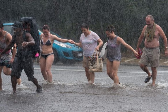 Brighton Beach-goers seek shelter from the rain