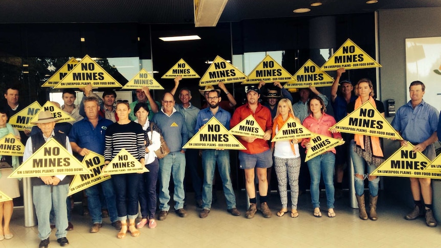 Farmers gather at Tamworth Airport ahead of Premier Mike Baird's arrival. February 2015.