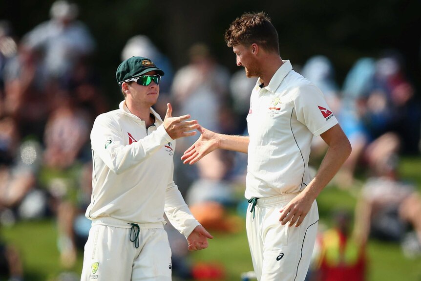 Jackson Bird is congratulated by Steve Smith after taking five wickets on day four in Christchurch.