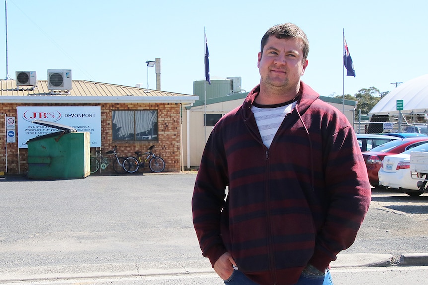 JBS employee Ben Wright, outside the company's Devonport plant.