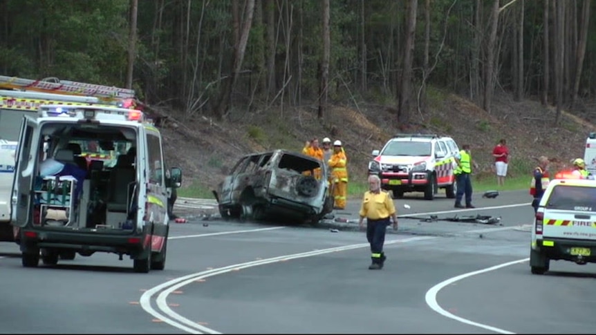 Emergency services work at the scene of a horrific accident on the Princes Highway near Bendalong