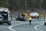 Emergency services work at the scene of a horrific accident on the Princes Highway near Bendalong