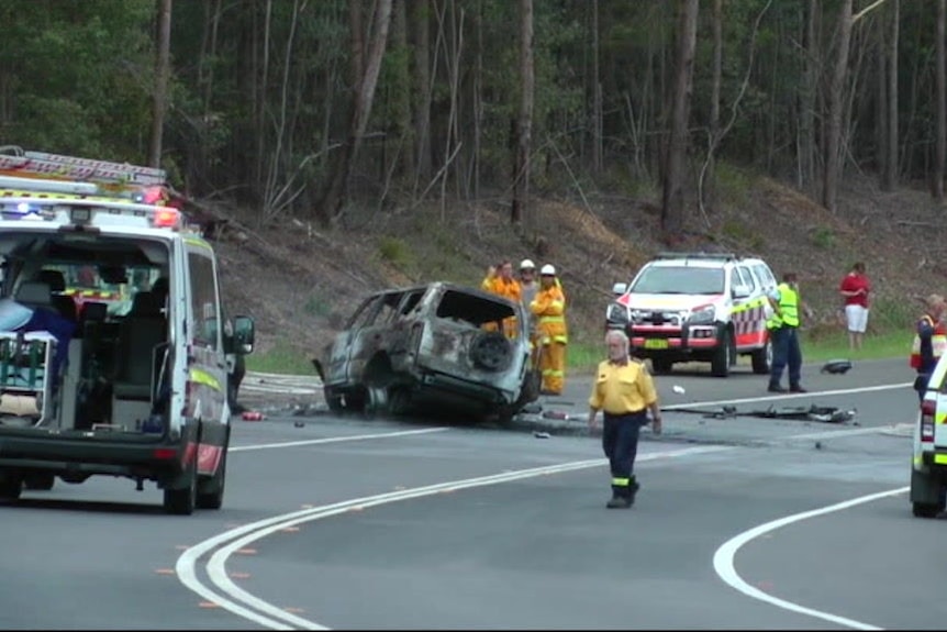 Emergency services work at the scene of a horrific accident on the Princes Highway near Bendalong