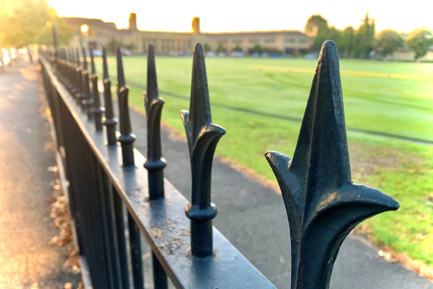 A photo of a fence outside Wesley College.