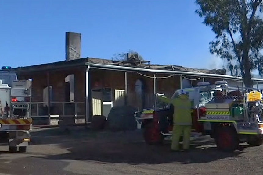 The Ora Banda pub after the fire tore through it, with fire trucks at the front of the building.