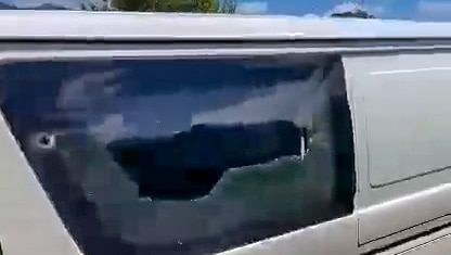 Damage caused to the window of a van.