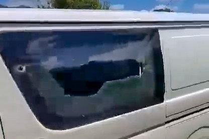 Damage caused to the window of a van.