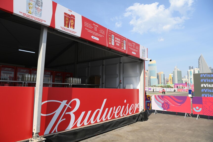 An empty Budweiser stall in a vacant area outside a World Cup stadium