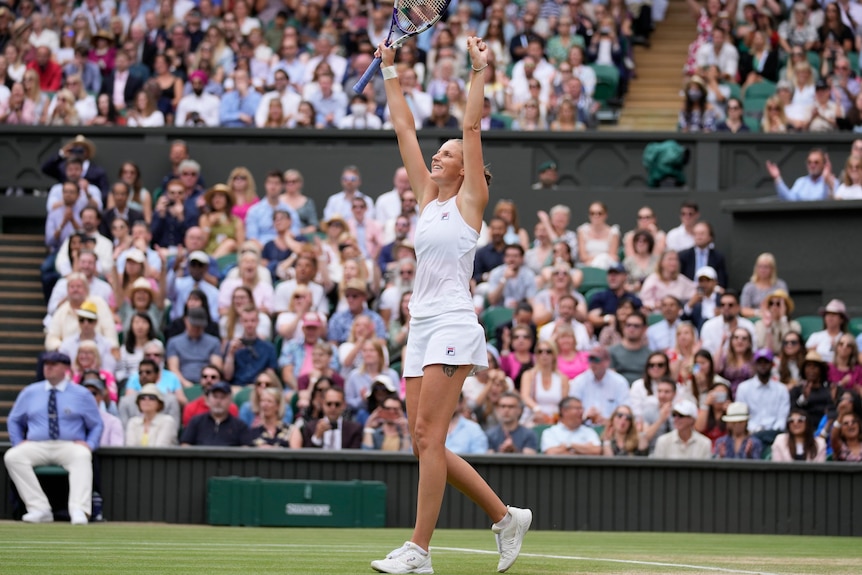 Karolina Pliskova raises her arms in triumph