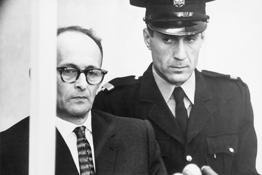 Adolf Eichmann listening to his indictment being read