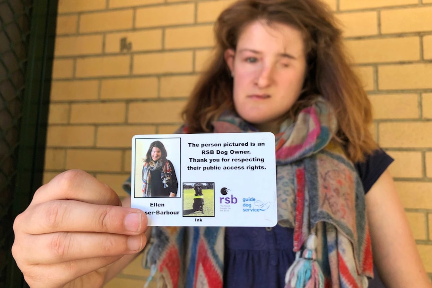 Ellen Fraser-Barbour shows her guide dog owner's identification card.