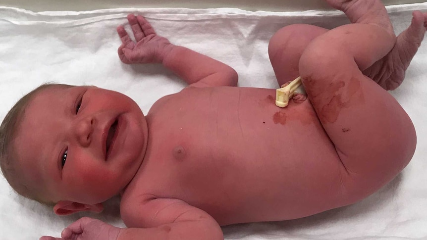 a brand new baby lying on scales at the Warrnambool Base Hosptial