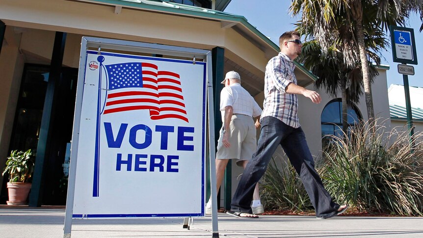 Voters in the Republican presidential primary enter and leave a polling place in Boca Raton, Florida.