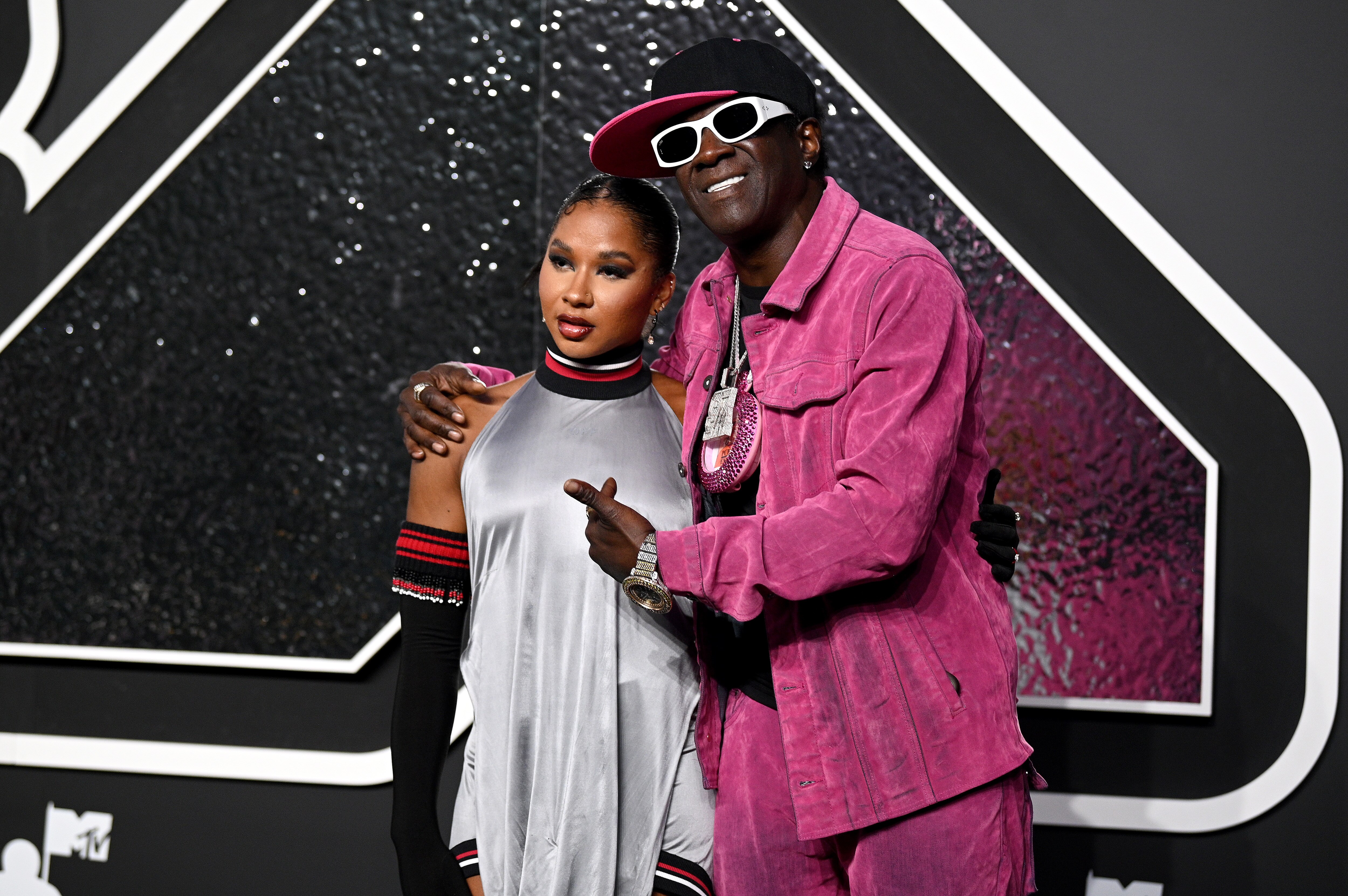 Gymnast Jordan Chiles and Flavor Flav on the VMAs red carpet