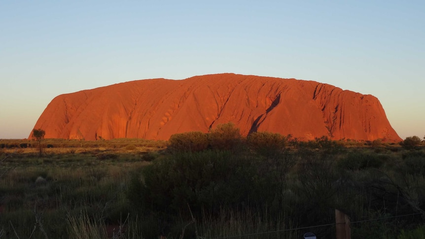 glowing red of Uluru at sunset