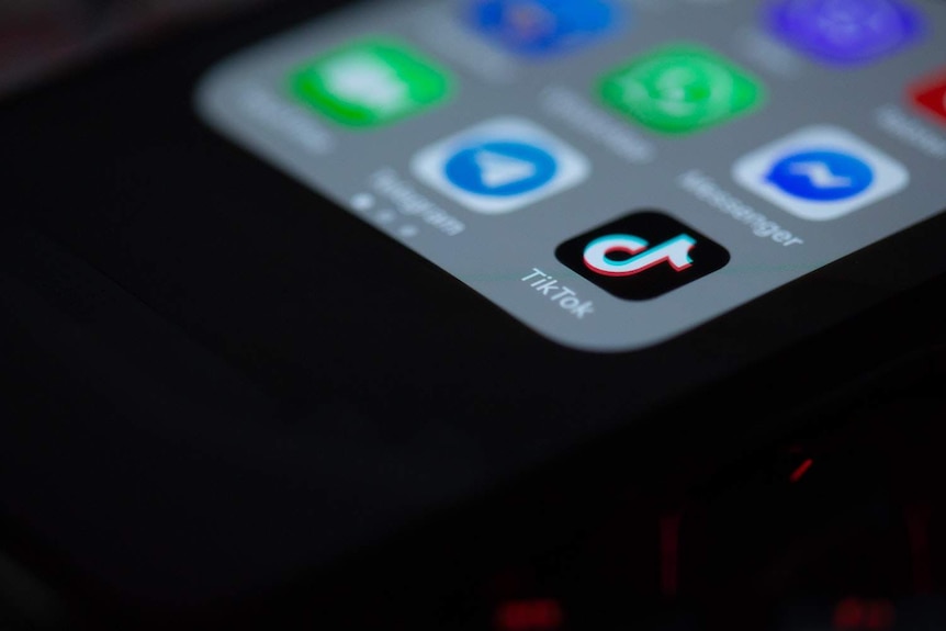A close up of the TikTok app icon on a phone