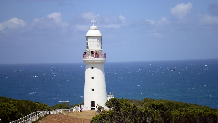 An historic lighthouse overlooks the ocean