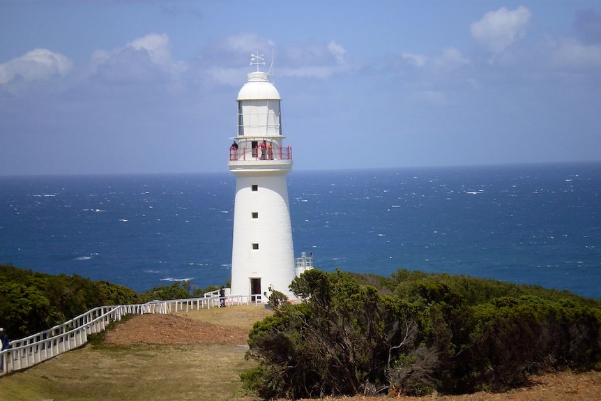 An historic lighthouse overlooks the ocean