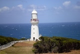 An historic lighthouse overlooks the ocean