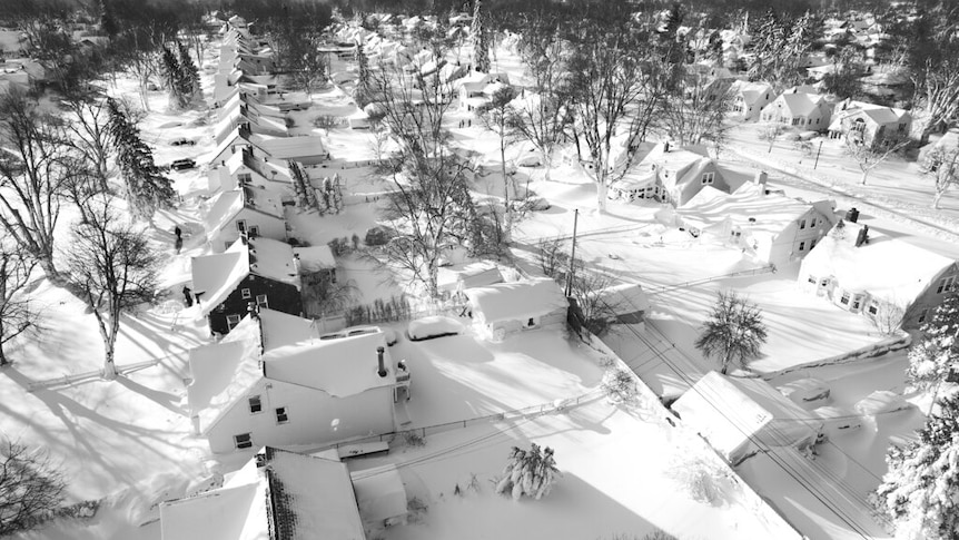 In this drone image, snow blankets a neighborhood, Sunday, Dec. 25, 2022, in Cheektowaga, N.Y. 