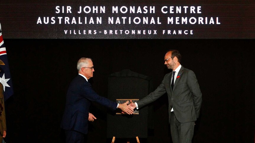 French Prime Minister Edouard Philippe (right) and Malcolm Turnbull unveil a plaque.