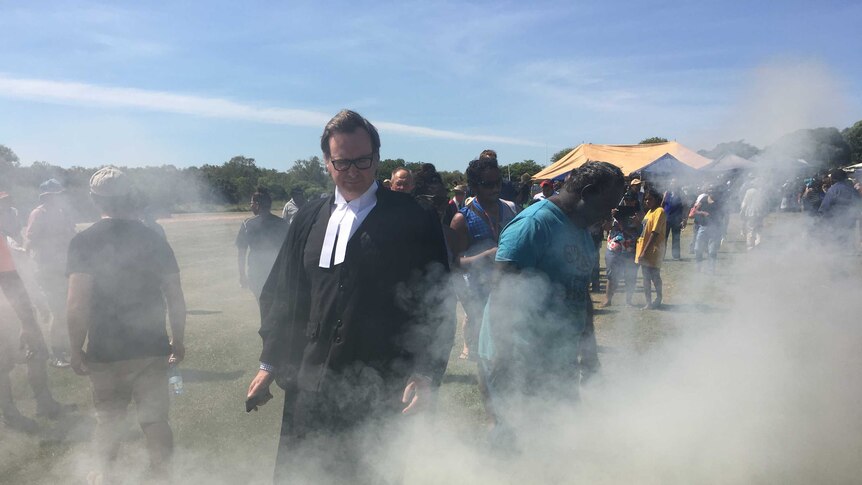 Justice North during a smoking ceremony at the James Price Point native title determination.