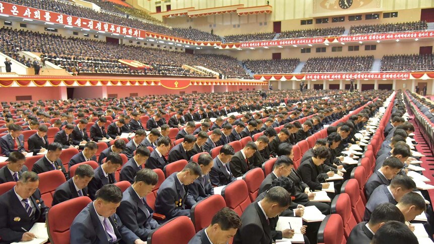 Attendees take notes at the Workers' Party of Korea conference