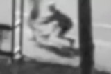 A blurry image of a man grabbing a female jogger