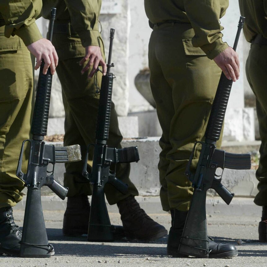 the legs of several soliders standing in a group