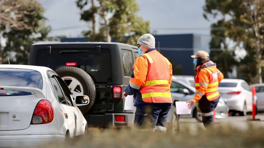 Cars line up at a COVID testing centre.