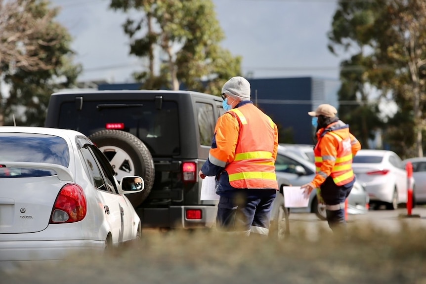 Cars line up at a COVID testing centre.