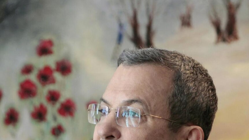 Ehud Barak attends a news conference at the Knesset