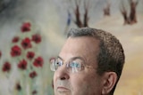Ehud Barak attends a news conference at the Knesset