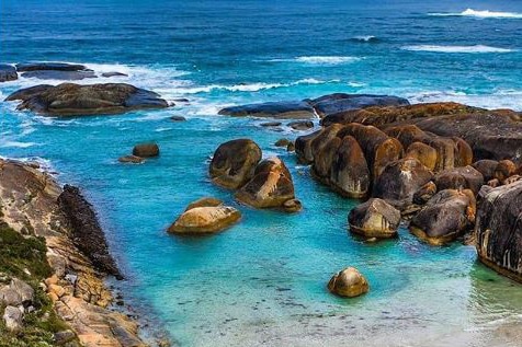 A man stands near the water at Elephant Cove near Denmark in WA's south.