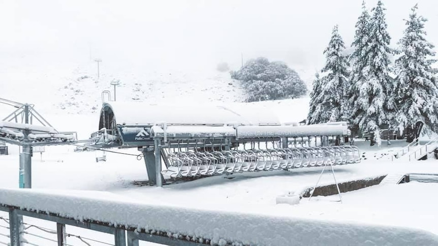 snow covered chairlift