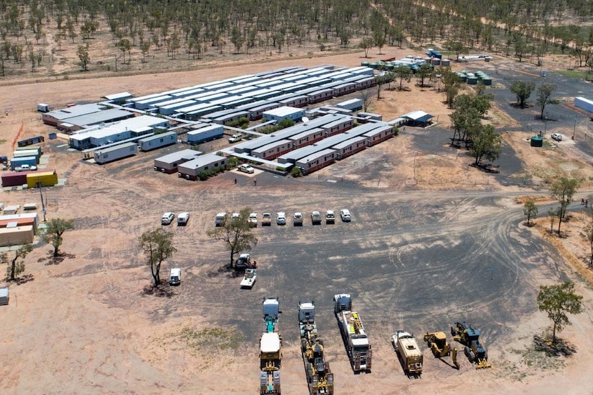 Aerial photo of trucks on the ground at Adani's Carmichael coal mine site in central Queensland.