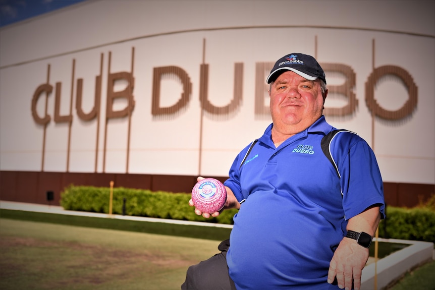 A man with a lawn bowl