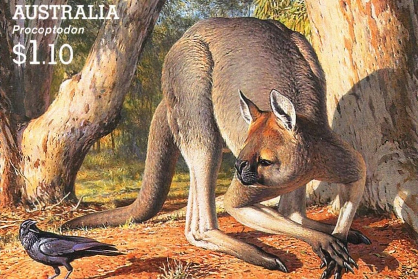 A kangaroo-like creature with a stubby face is pictured on a postage stamp.
