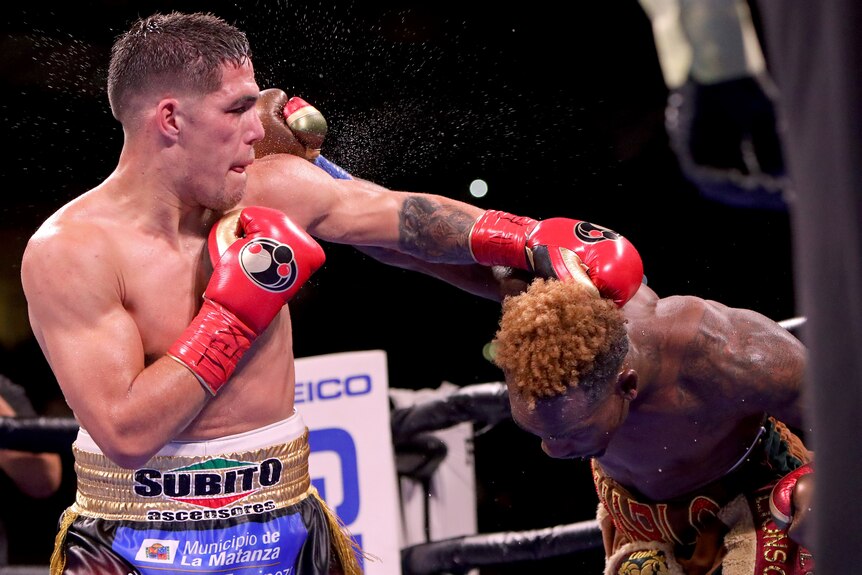 Brian Castano punches down at Jermell Charlo