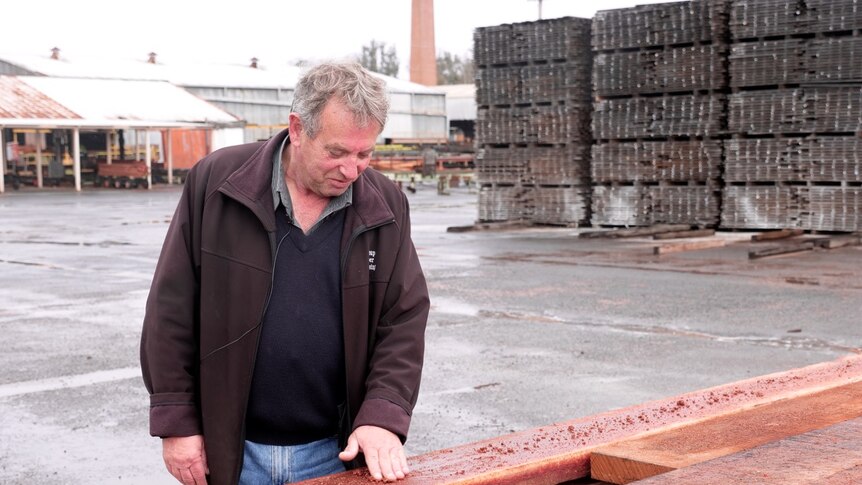 Nannup Timber Mill General Manager Vince Corlett inspects sawn timber