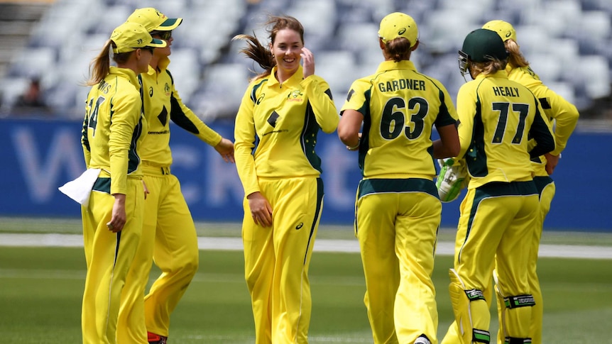 Amanda Wellington of Australia (C) celebrates during the Women's T20 International v New Zealand.