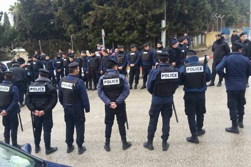 Police line the street for teachers strike in Palestine