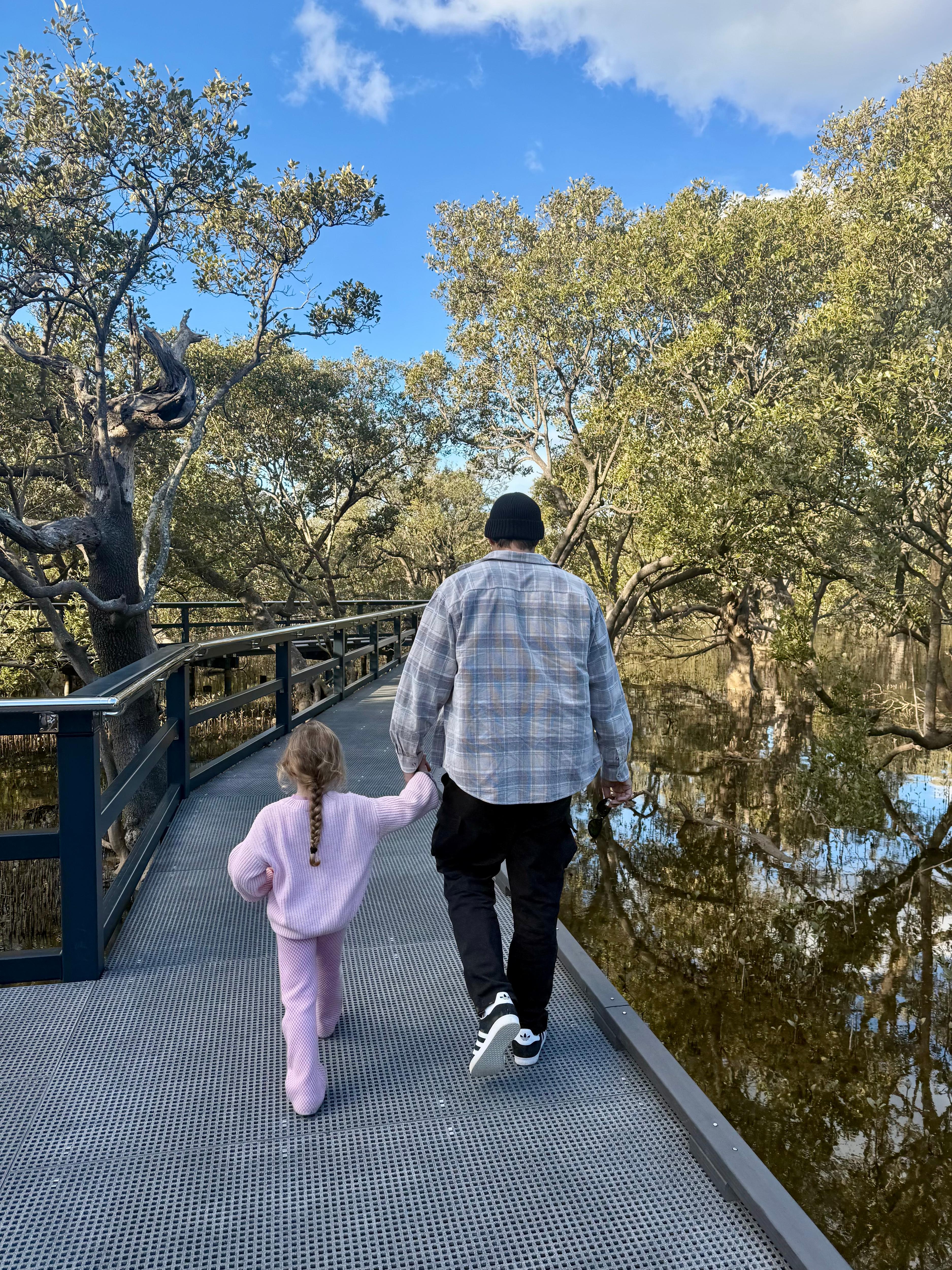 Billy holding hands with his daughter
