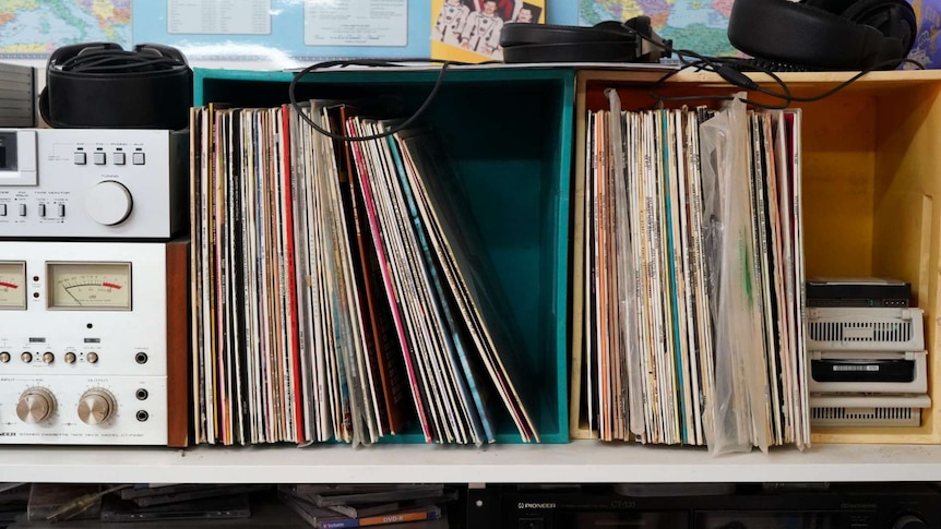 Containers of records line a wall in Tony Hutchison's home radio shack.