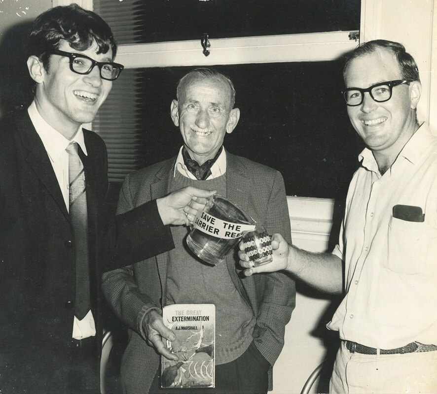 Black and white photo of Eddie Hegerl (left) and John Busst (centre), unknown man on right, campaigning in Innisfail.