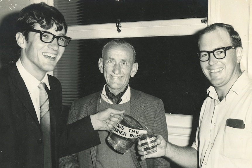 Black and white photo of Eddie Hegerl (left) and John Busst (centre), unknown man on right, campaigning in Innisfail.