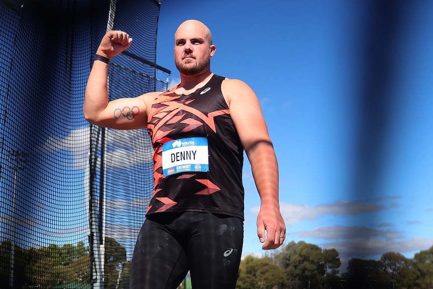 Matt Denny clenches his fist after a national record-breaking throw