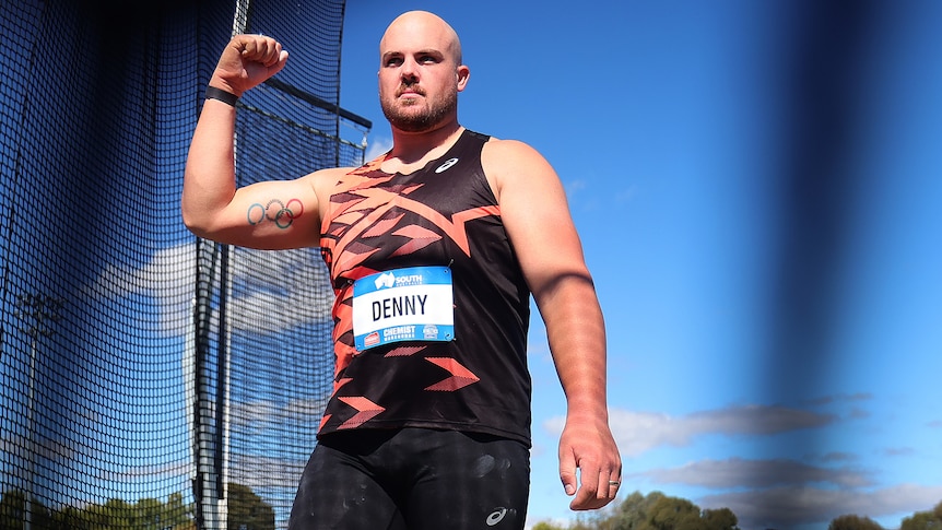 Matt Denny clenches his fist after a national record-breaking throw