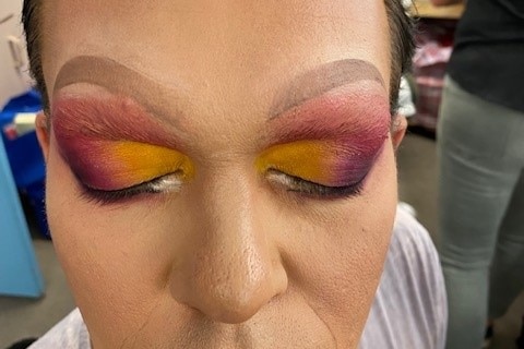 A close-up of coloured eye make-up on one of the Spotlight Theatre performers