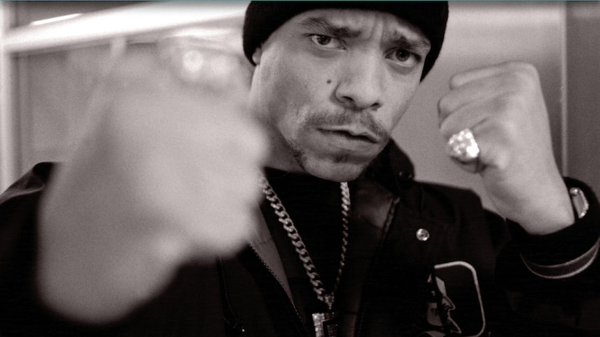 black and white photo of Ice-T putting his fists up